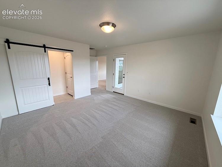 Image 20 of 50: The Primary Bedroom walks out to the Balcony!