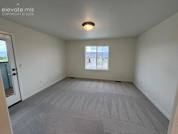 Image 21 of 50: The Primary Bedroom walks out to the Balcony!