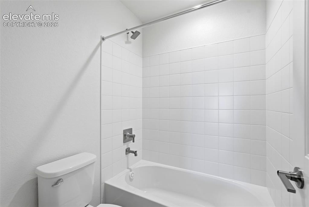 Image 36 of 50: Spacious Laundry Room located on the upper level