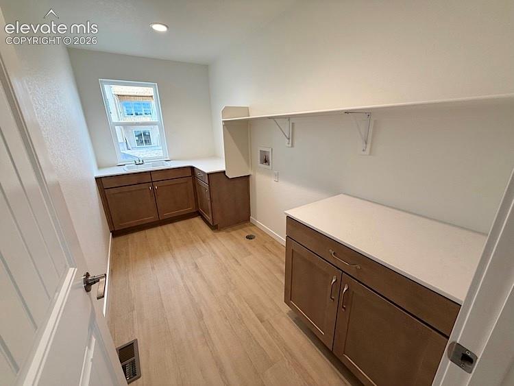 Image 38 of 50: Laundry Room located on the Upper Level