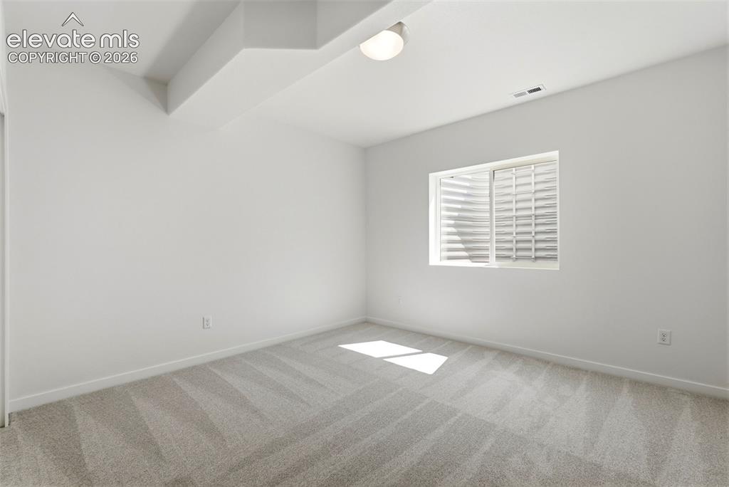 Image 43 of 50: Bedroom 4 located in the lower level