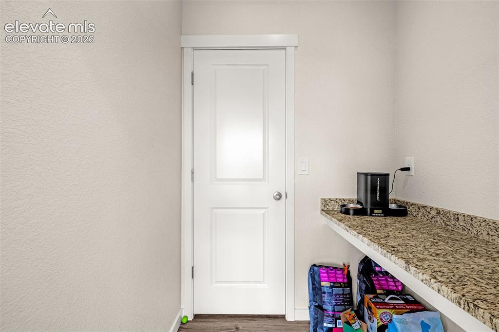 Image 15 of 43: Small office desk and pantry