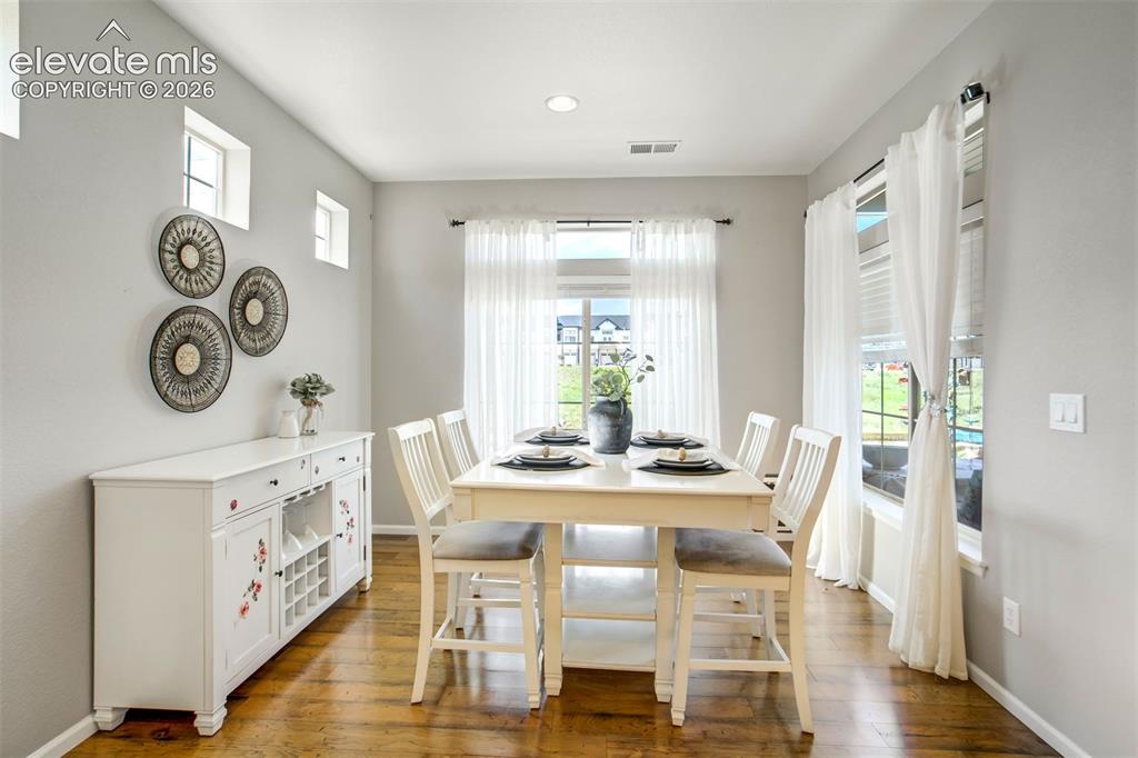 Image 13 of 46: Breakfast nook dining area with plenty of natural light to get your day sta