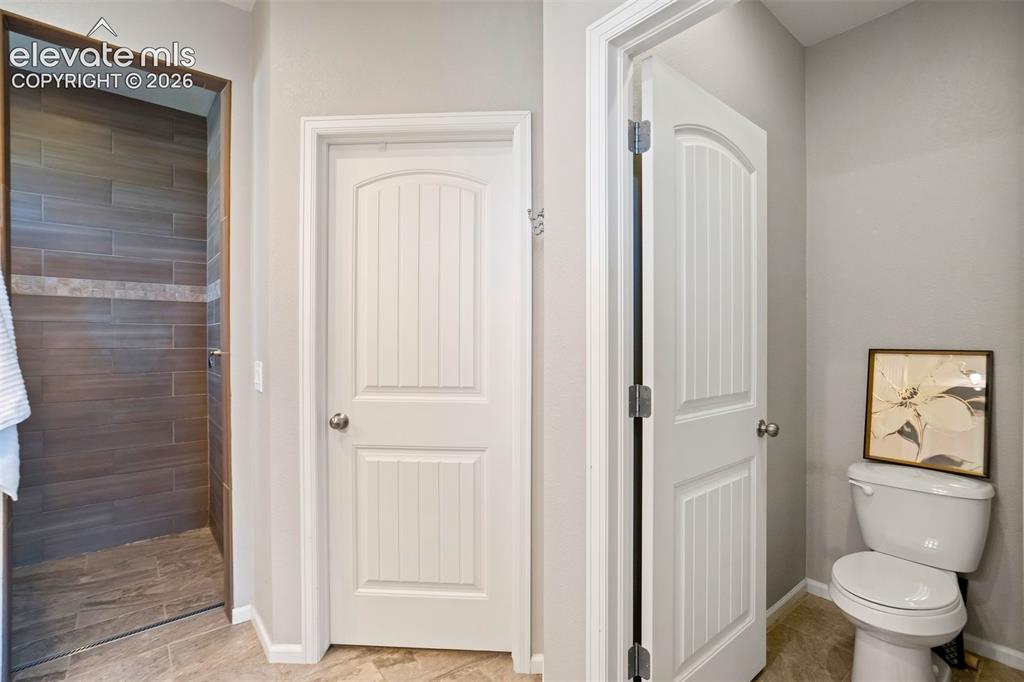 Image 21 of 46: Water closet has a door. And the walk-in closet is also a must see.