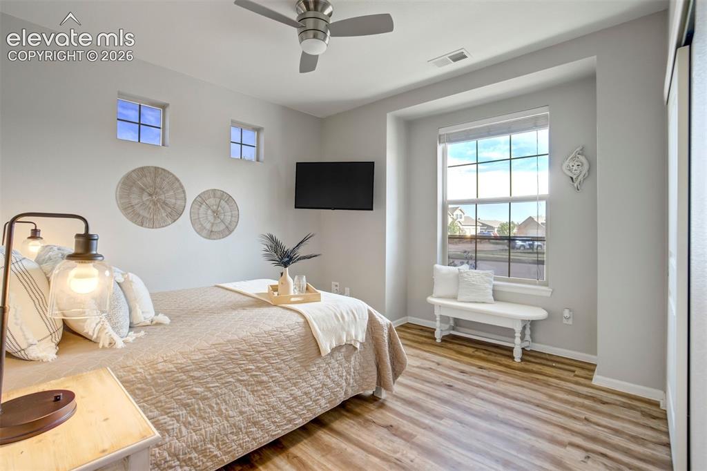 Image 24 of 46: Main level secondary bedroom- ready for visitors—or permanent residents.