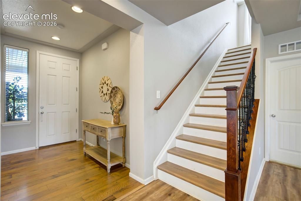 Image 27 of 46: Another look at the entry and stairs leading to the upstairs Suite.