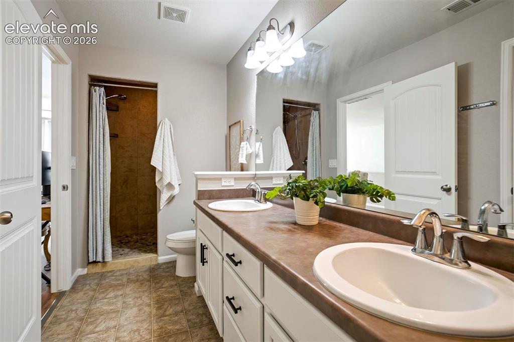 Image 35 of 46: Upstairs full bathroom for the Jr. Suite.