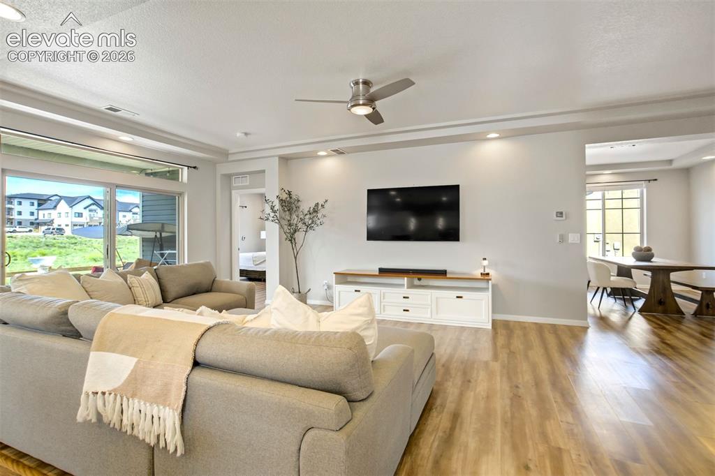 Image 7 of 46: An open, inviting space designed for gathering, relaxing, and claiming "you