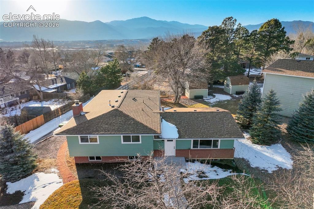 Image 2 of 43: Contemporary split-level residence featuring a multi-gable roofline and a b