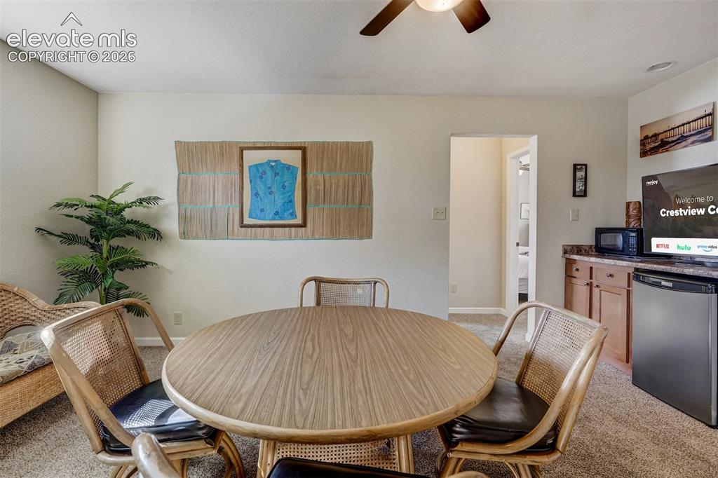 Image 32 of 43: Built-in cabinetry with a countertop, recessed lighting, and a ceiling fan