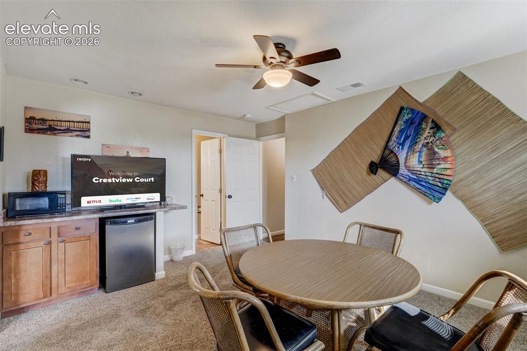 Image 33 of 43: Built-in cabinetry with a countertop, recessed lighting, and a ceiling fan
