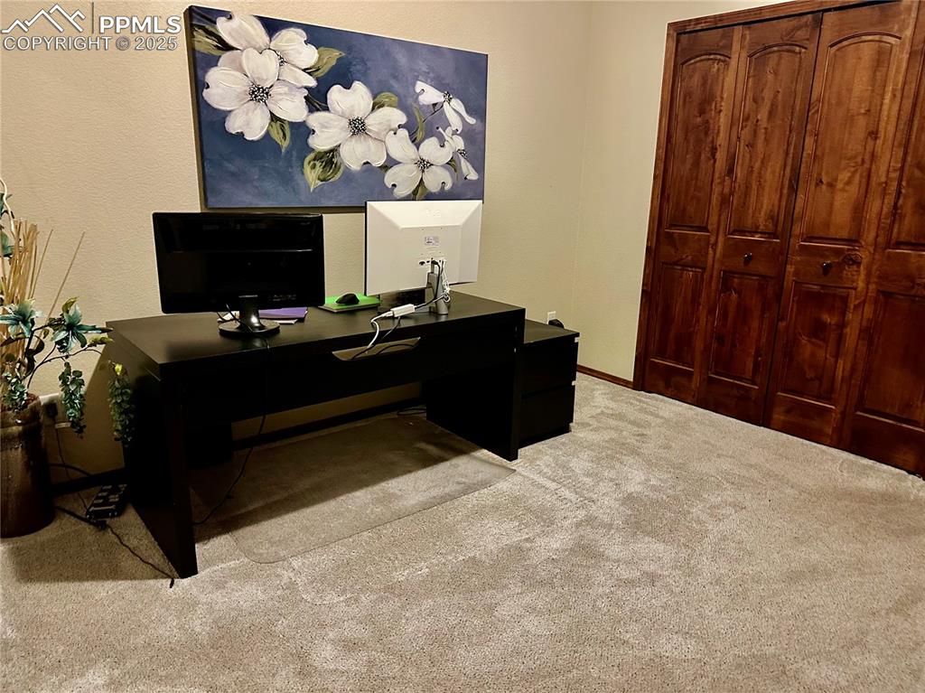 Image 26 of 33: Office space featuring carpet flooring and baseboards