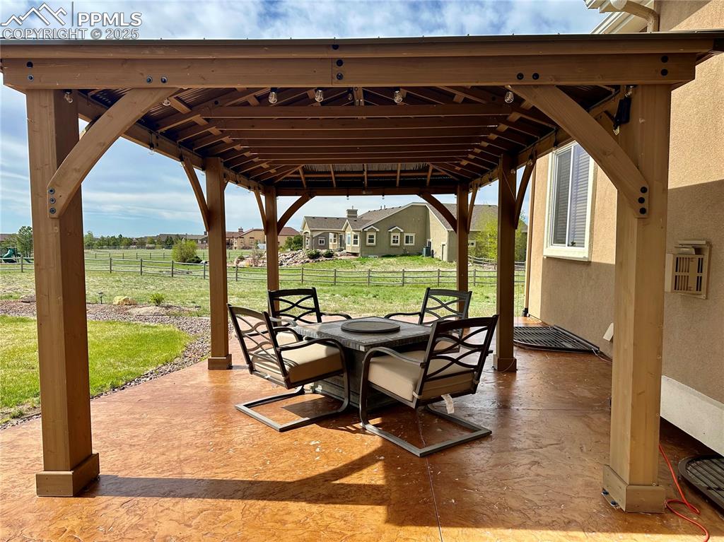 Image 31 of 33: View of patio / terrace featuring a gazebo