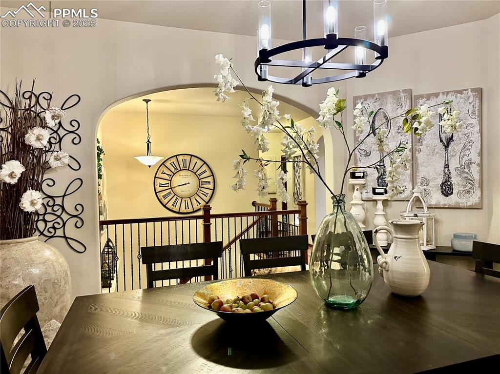 Image 9 of 33: Dining room featuring a chandelier and arched walkways