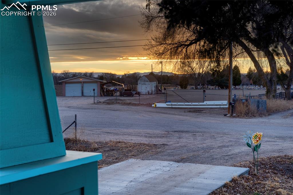 Image 10 of 50: Sunset from the porch with mountain views