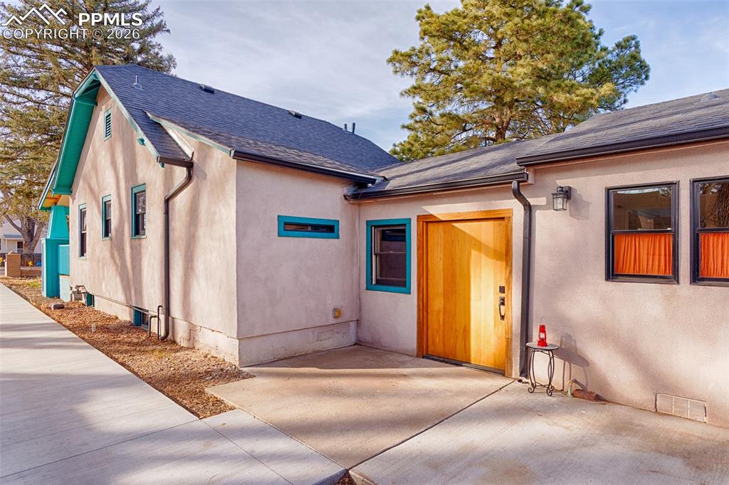 Image 12 of 50: Side view of the main house and later additions with side entry door (Pivot