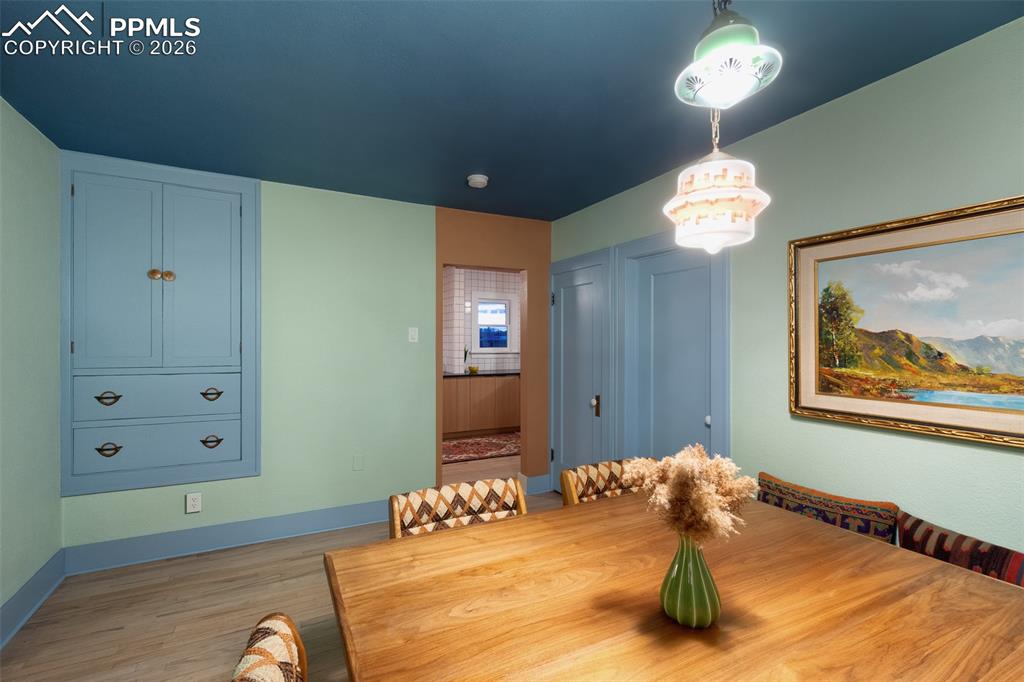 Image 15 of 50: Dining room with custom built dining table and built in bench that will sta