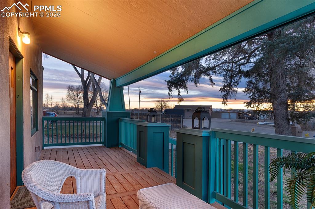 Image 9 of 50: Sunset from the porch with mountain views