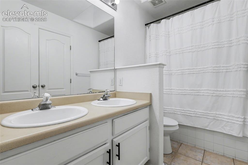 Image 16 of 34: Main Level Full Bathroom