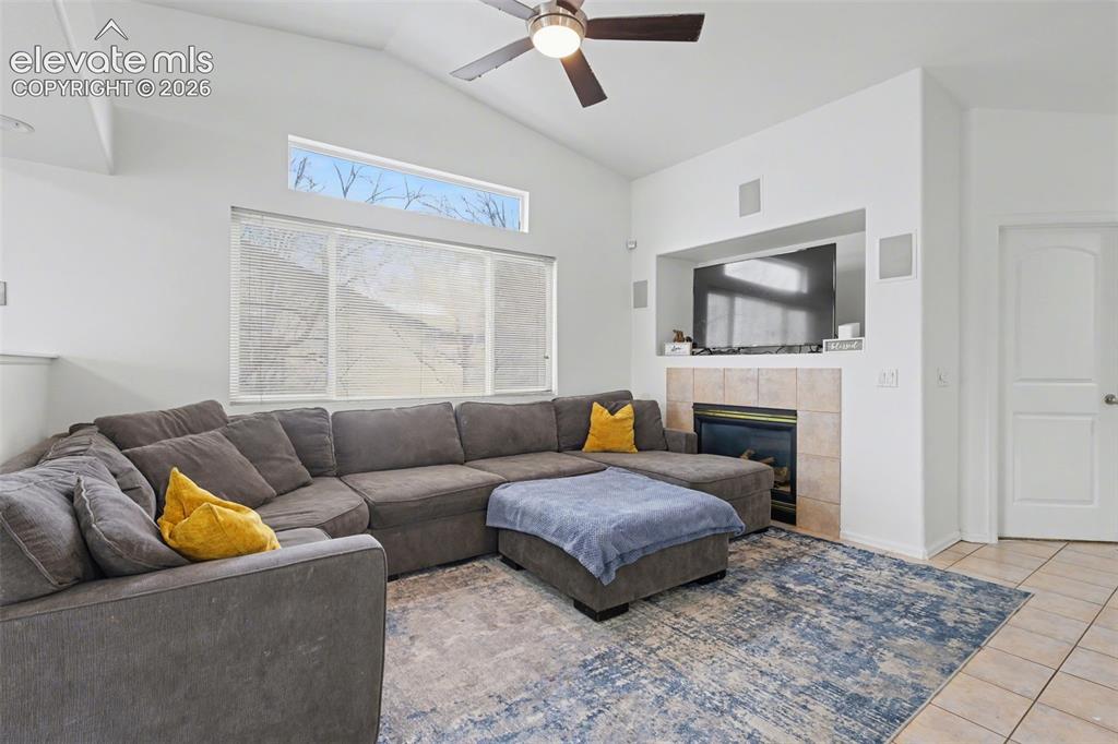 Image 8 of 34: Enjoy Vaulted Ceilings, Gas Fireplace, & Low Maintenance Custom Tile Floori