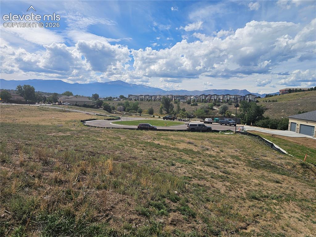 Image 6 of 7: Undeveloped lot featuring a prominent mountain backdrop, rolling topography