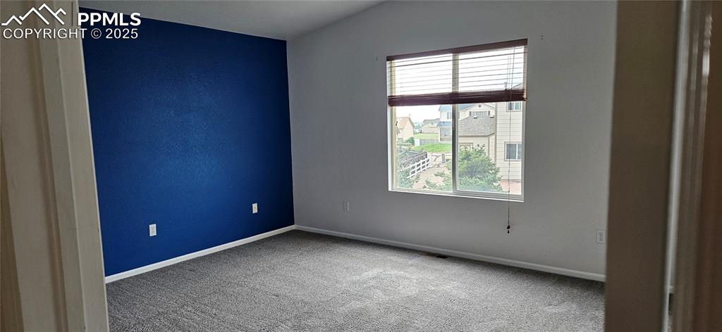 Image 13 of 26: Carpeted spare room featuring baseboards
