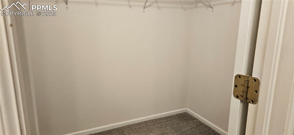 Image 15 of 26: View of primary bedroom walk in closet