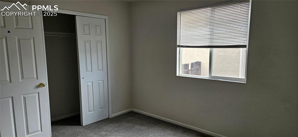 Image 18 of 26: 3rd bedroom with a closet and carpet