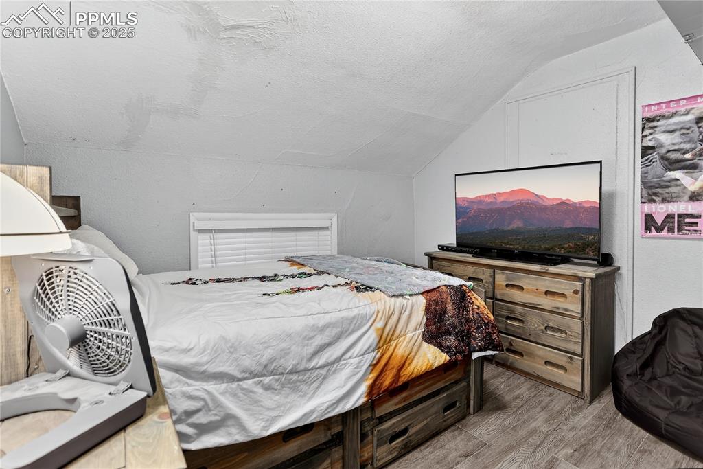 Image 11 of 50: One of two upper level bedrooms