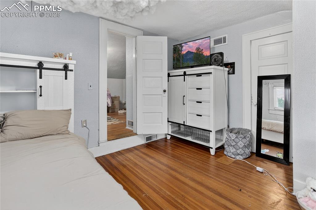 Image 13 of 50: Upper level bedroom