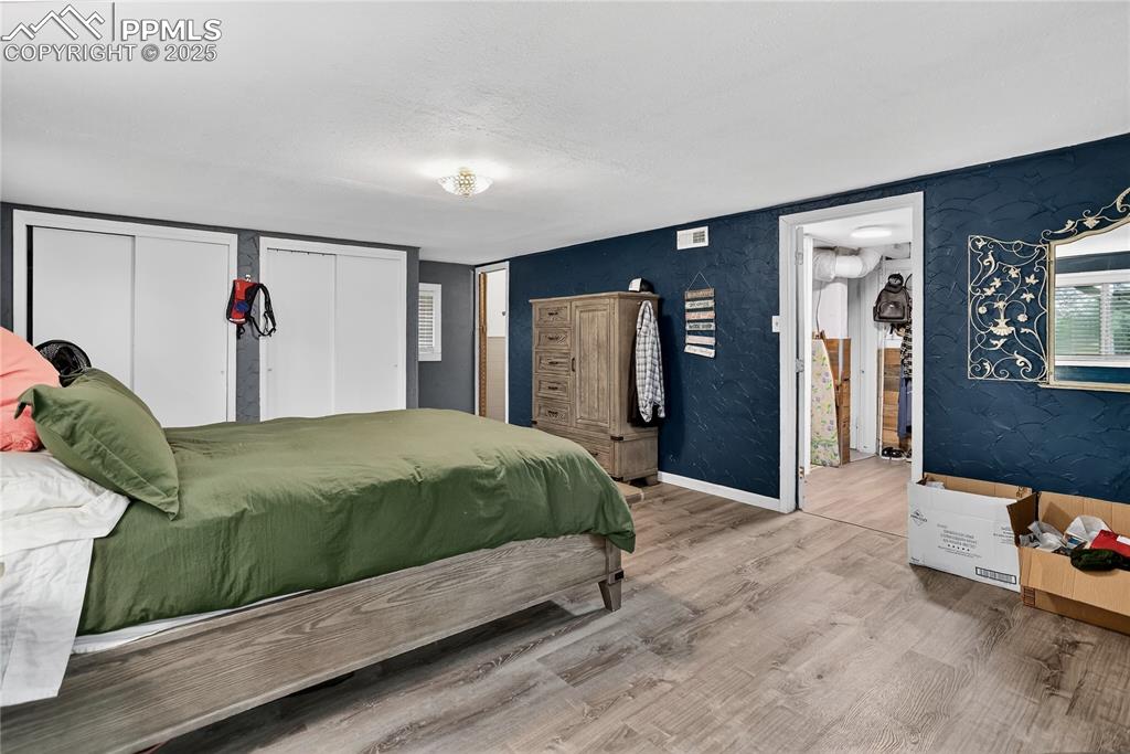 Image 37 of 50: Primary main level bedroom, private and large with an adjoining shower