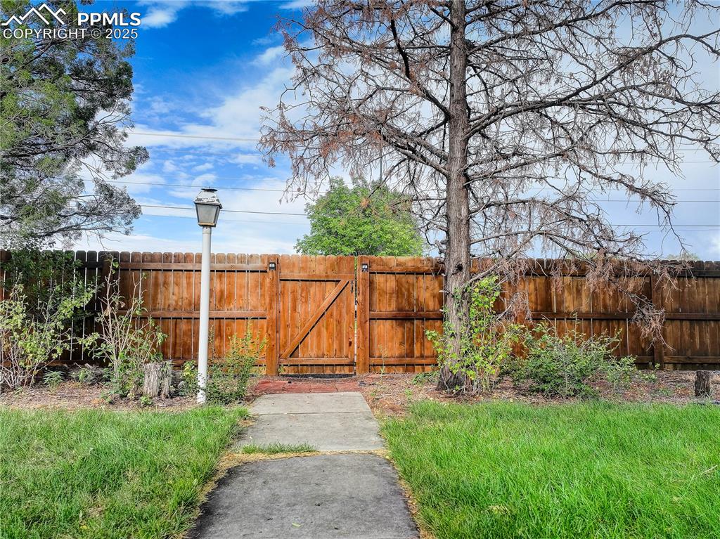 Image 48 of 50: View of yard with a gate
