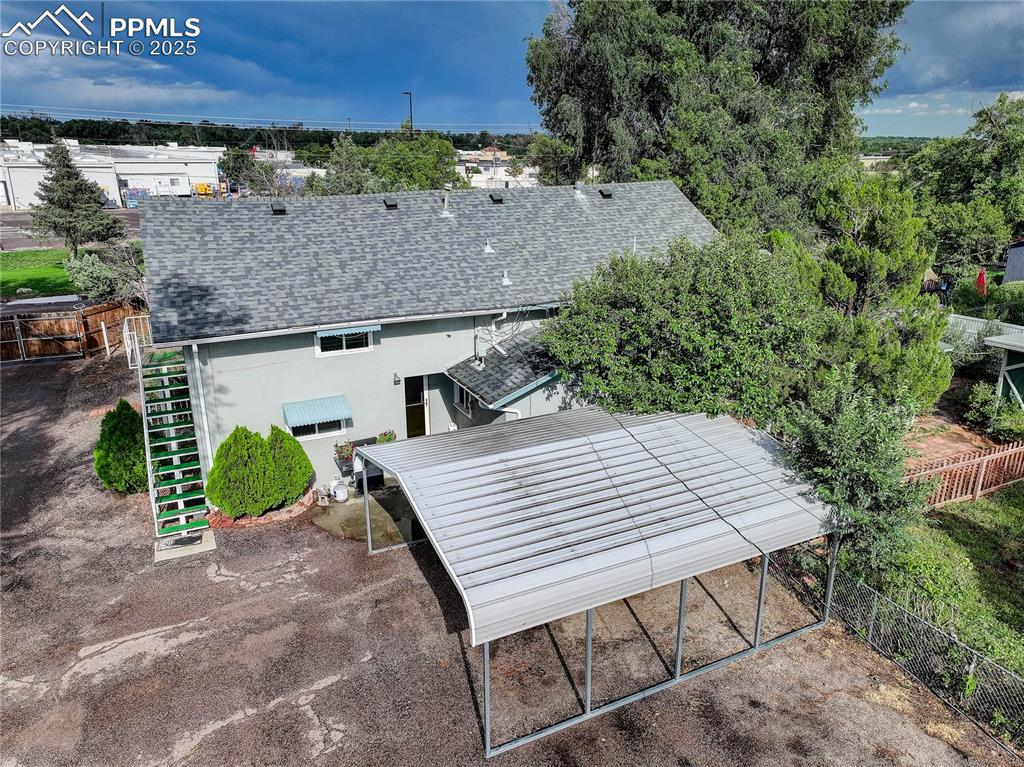 Image 9 of 50: This property has a 2 car carport....plus a 2 car garage with workshop and 