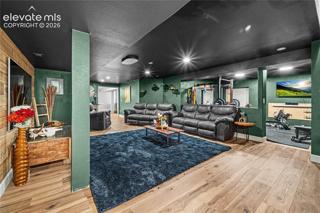 Image 31 of 50: Hardwood stairs with cable railing system and decorative wall paneling