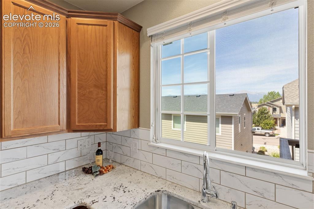 Image 10 of 40: View of Pikes Peak from kitchen