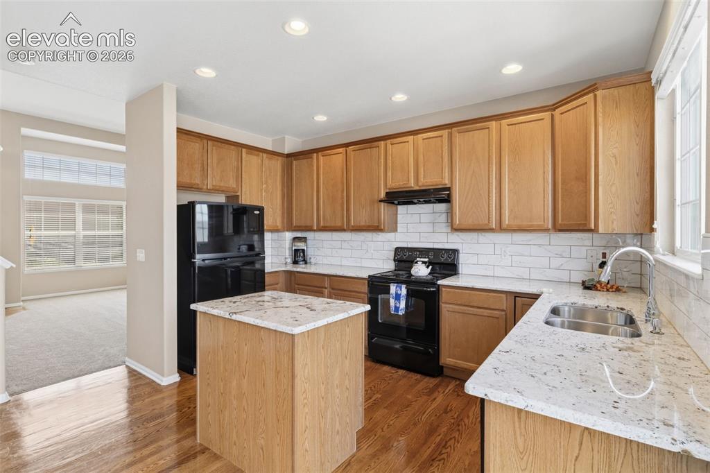 Image 7 of 40: New granite, backsplash, sink & faucet
