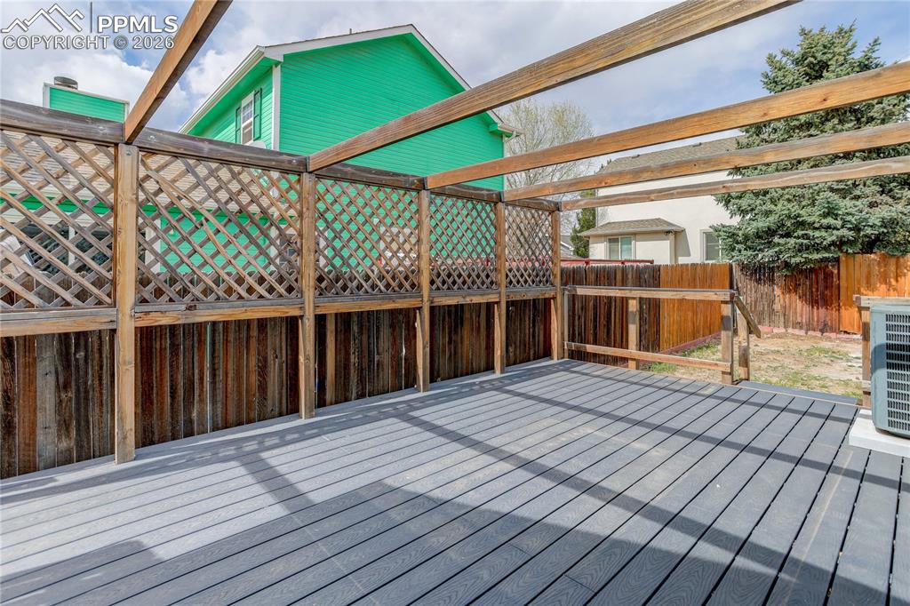 Image 16 of 17: Composite deck w/ pergola framing