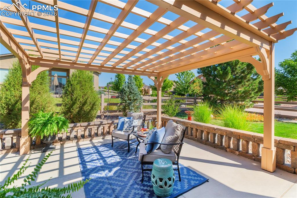 Image 10 of 50: View of patio / terrace with a pergola and outdoor furniture