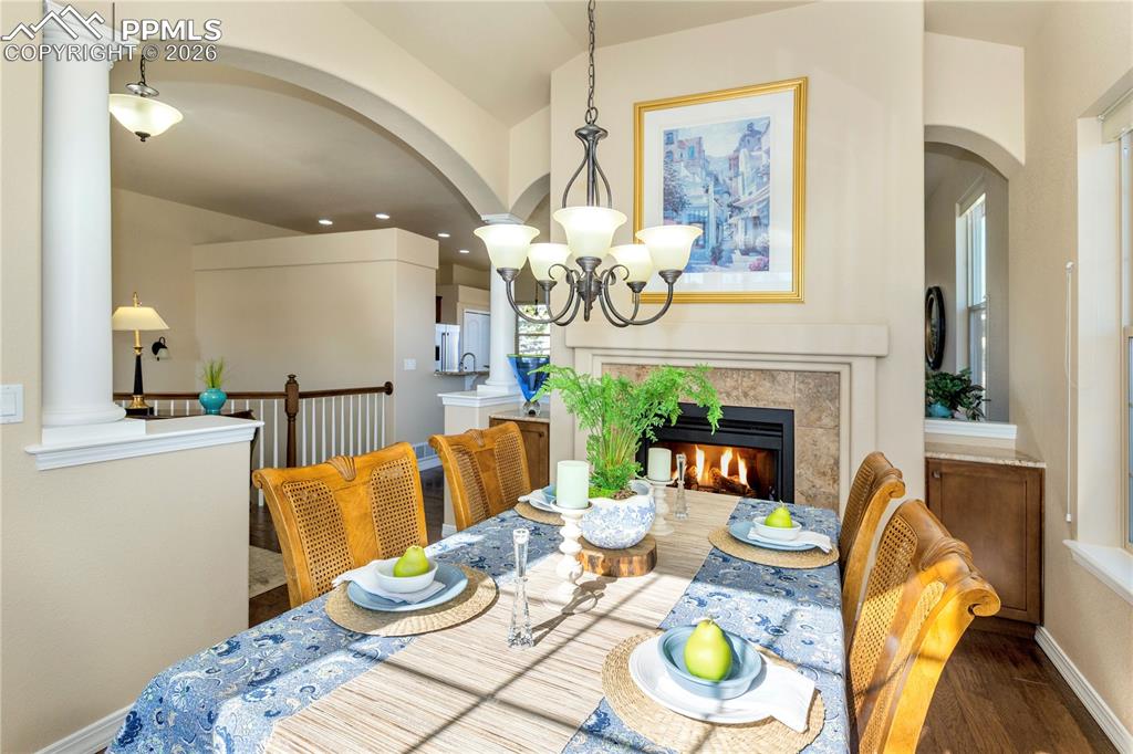 Image 17 of 50: The cozy double-sided gas fireplace creates a warm and inviting spot to lin