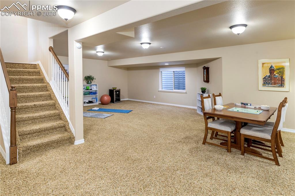 Image 38 of 50: Spacious downstairs family room can easily accommodate a large sectional fo