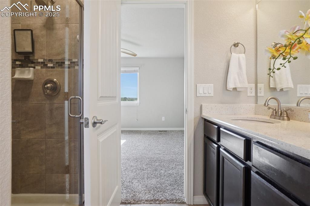 Image 24 of 46: Full bathroom with a shower stall and vanity