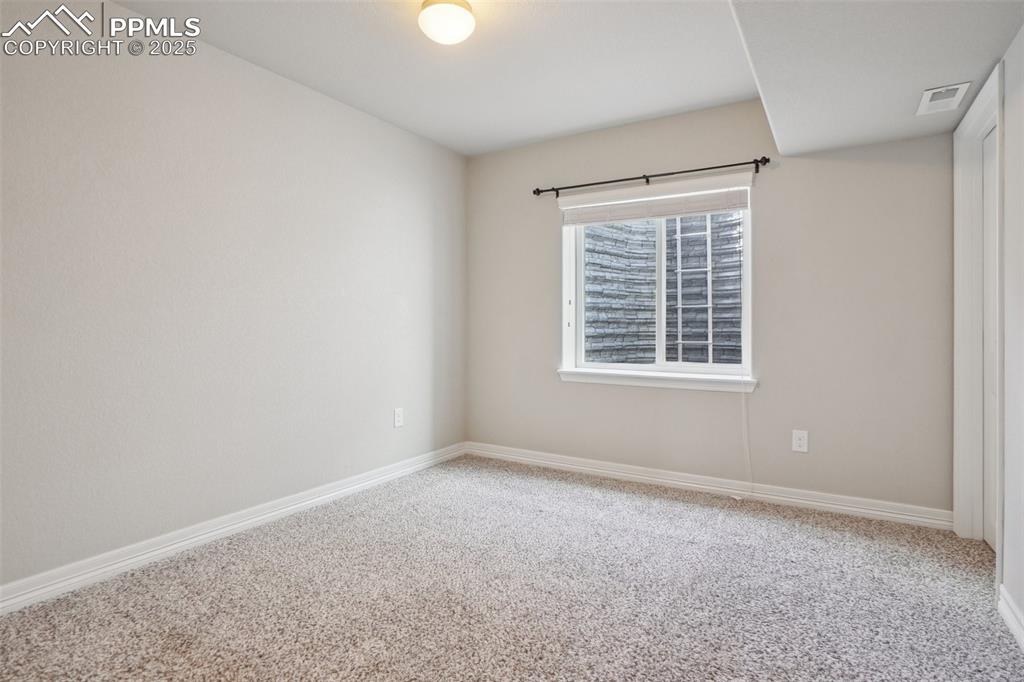 Image 30 of 46: Carpeted spare room with baseboards