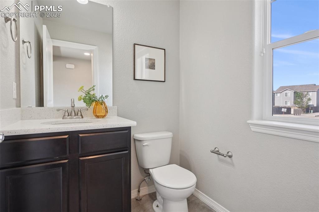 Image 34 of 46: Bathroom with toilet and vanity