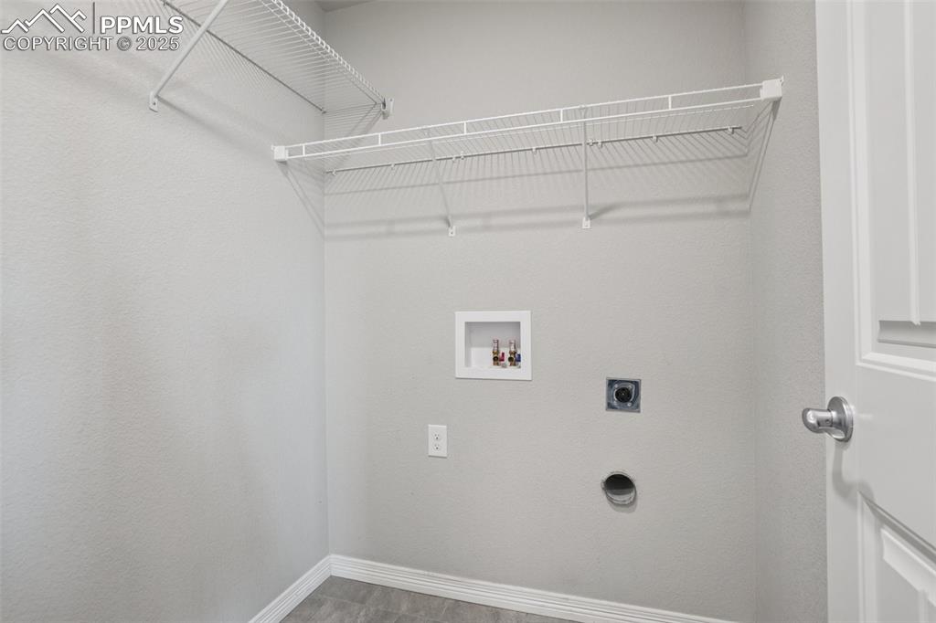 Image 35 of 46: Laundry area featuring hookup for an electric dryer and hookup for a washin