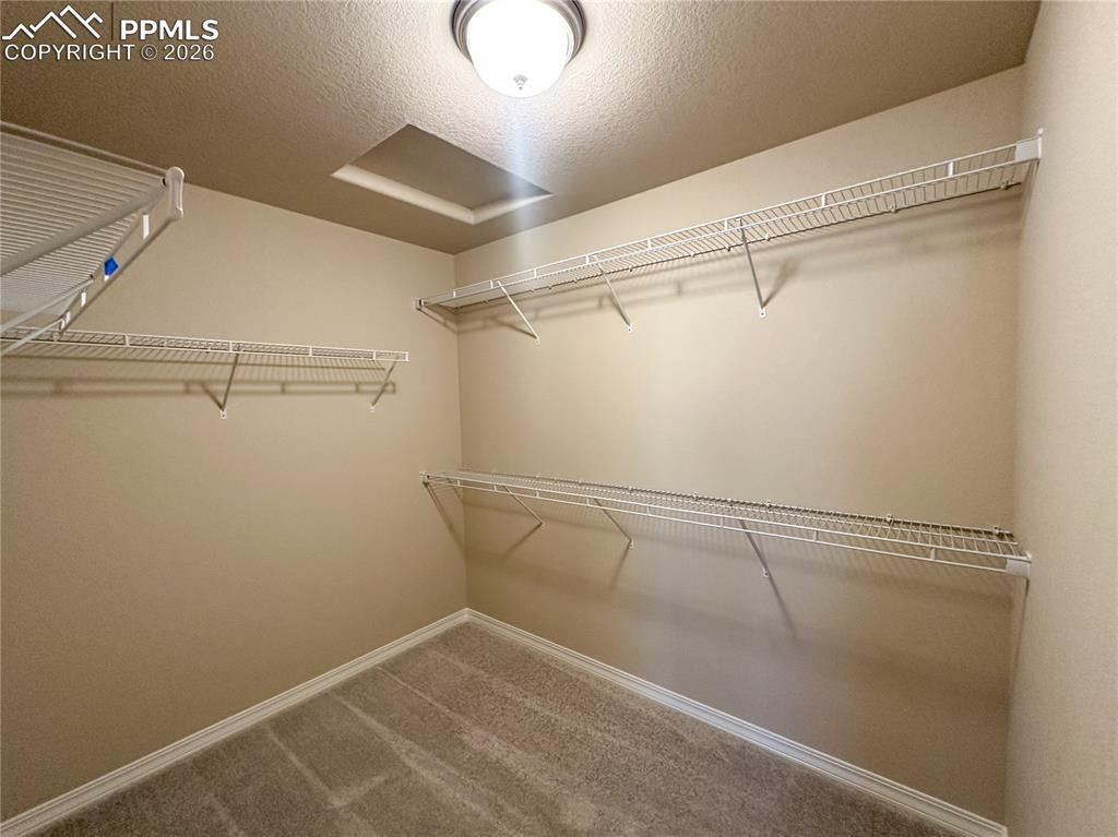 Image 22 of 36: Primary closet