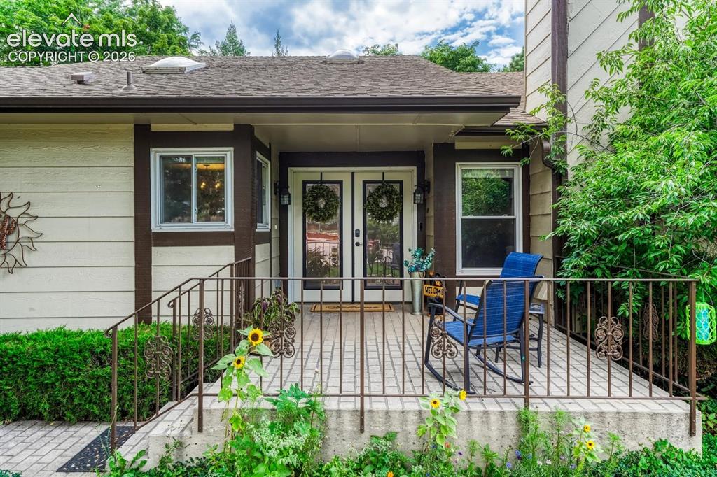 Image 2 of 49: Lovely front porch with great landscaping. 