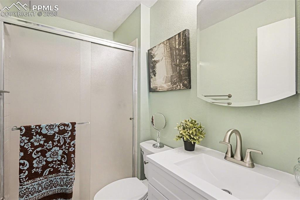 Image 13 of 24: New vanity, fixtures, and toilet