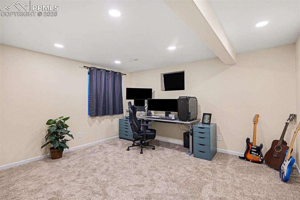Image 17 of 24: The basement includes a dedicated office with a closet—ideal as a workspace