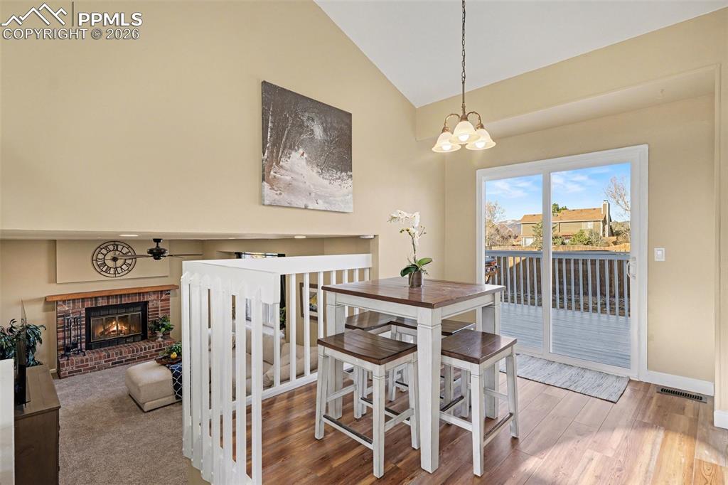 Image 5 of 24: Spacious dining area with walkout to deck & back yard.