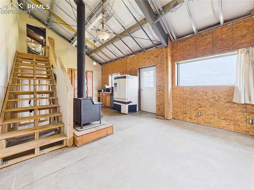 Image 17 of 50: Main Living Area (Alternate View) – Open-concept layout with metal ceiling 